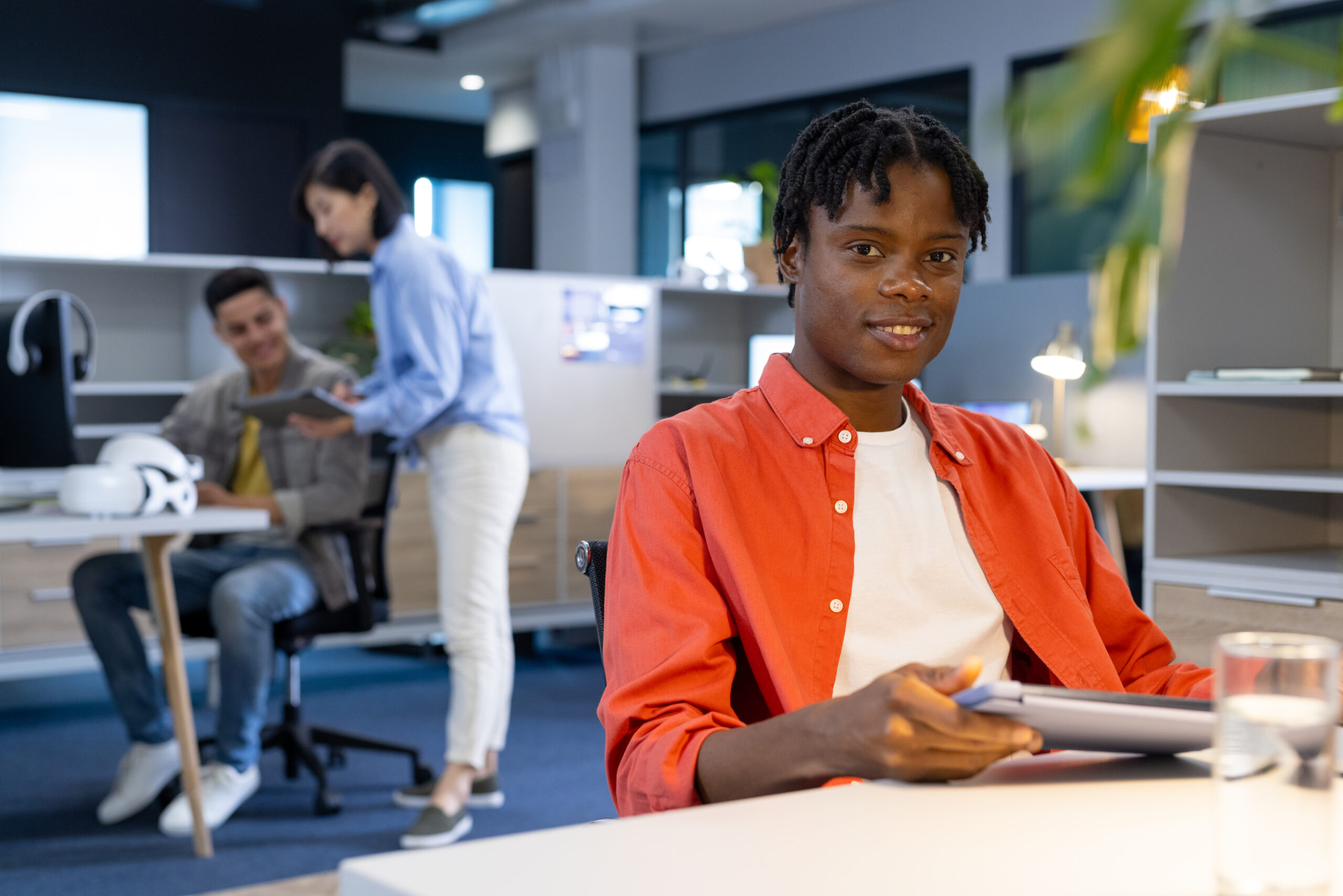 Diverse colleagues collaborating in modern office for business start-up teamwork, copy space. Bright, open-plan office with natural light and contemporary furniture creating welcoming space, unaltered Diverse colleagues collaborating in modern office for business start-up teamwork, copy space. Bright, open-plan office with natural light and contemporary furniture creating welcoming space, unaltered