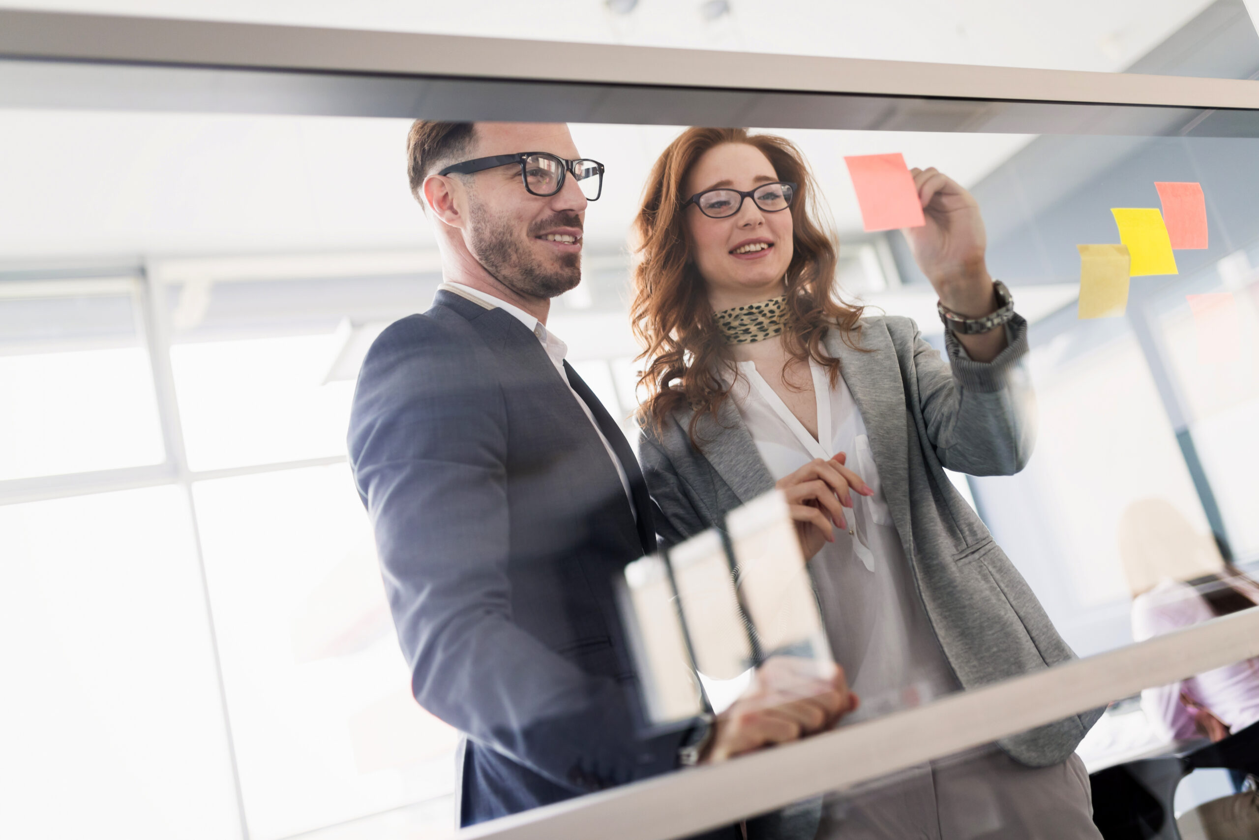 Corporate teamworking colleagues in bright modern office Corporate teamworking colleagues working in modern office